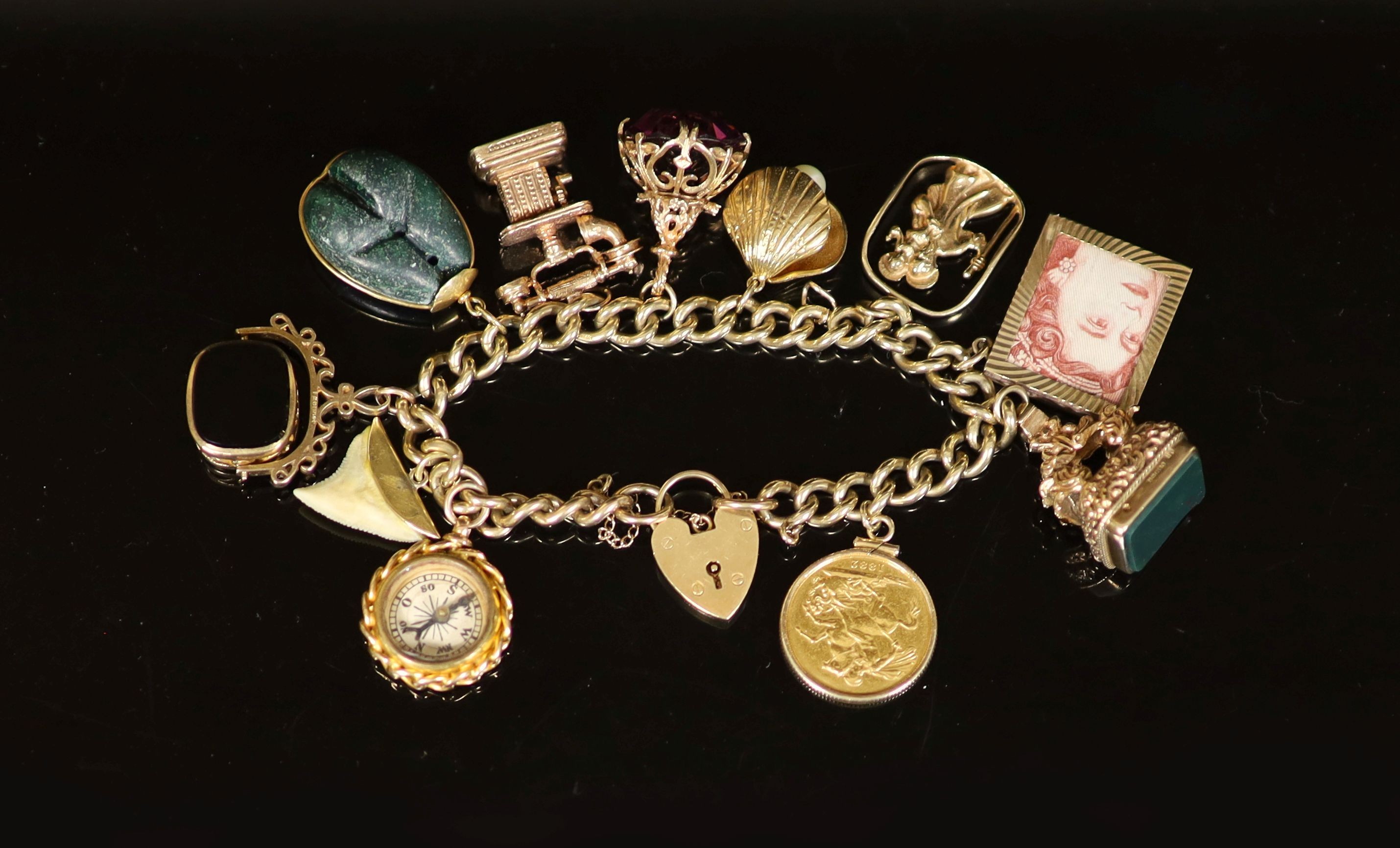 A 1970's 9ct. gold charm bracelet